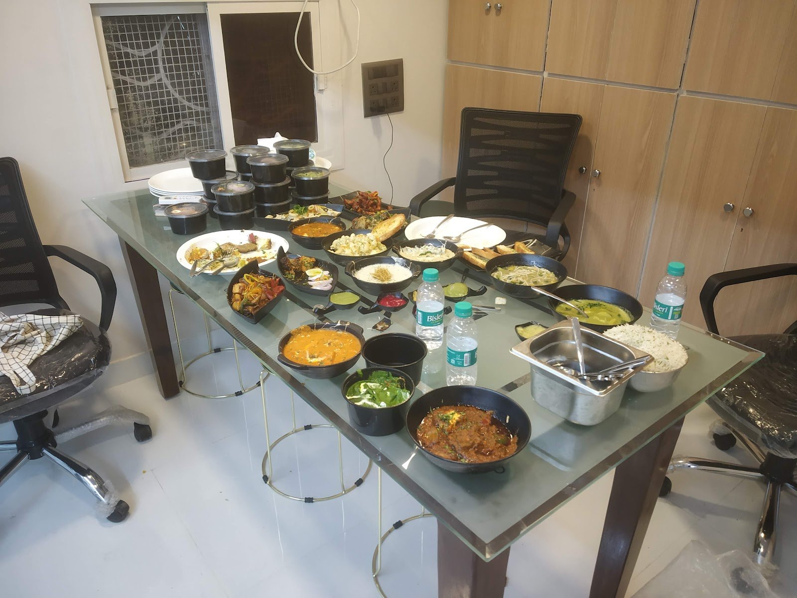 Table laid out with many dishes and bowls for tasting during menu development