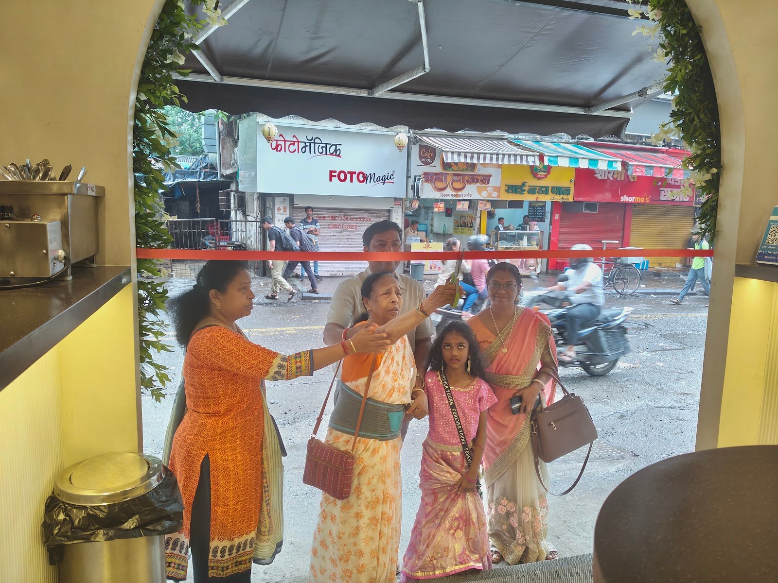 Guests gathered at the Madras Canteens entrance under a decorated archway
